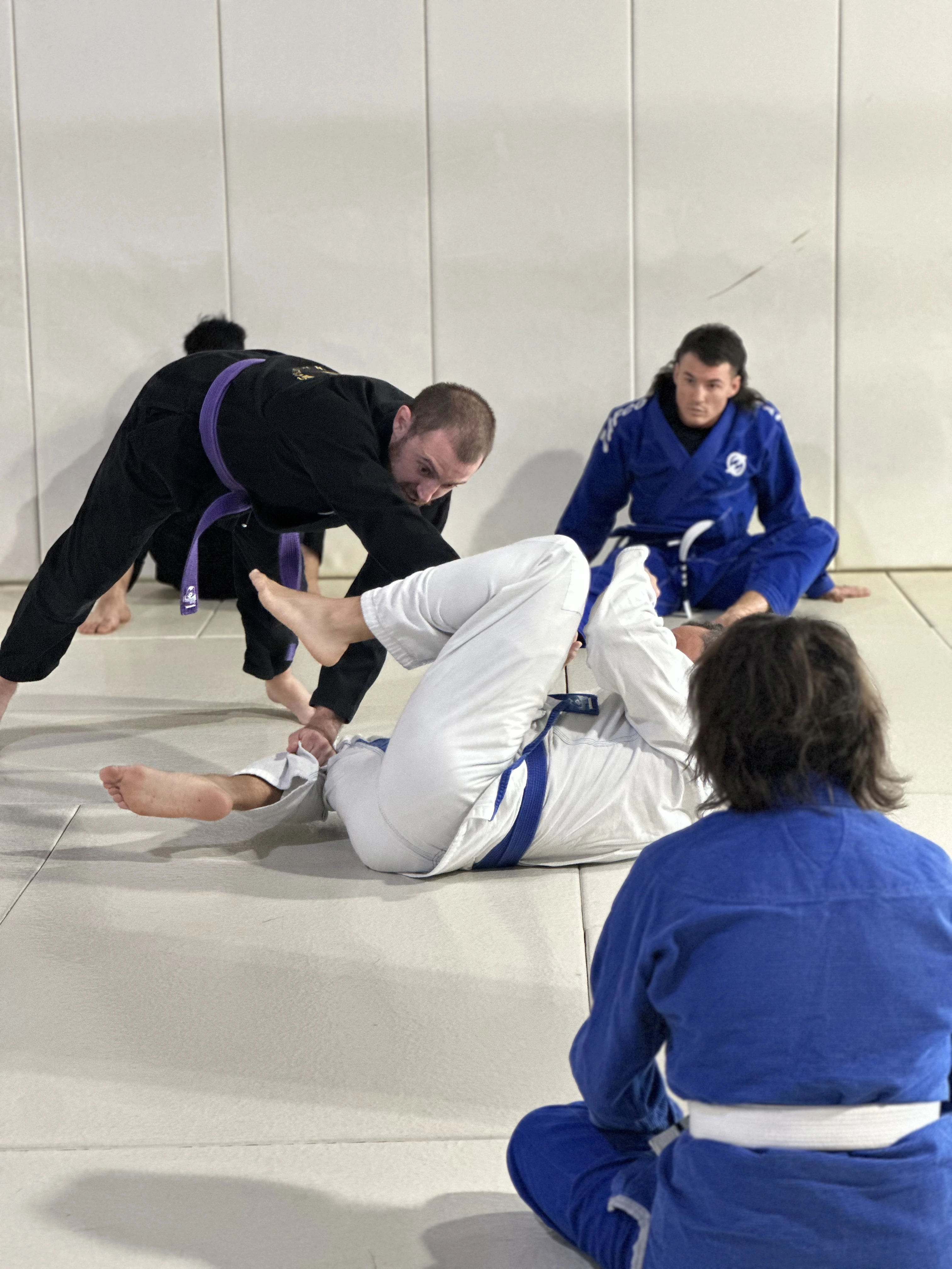 BJJ students rolling in gi class at Zombie BJJ