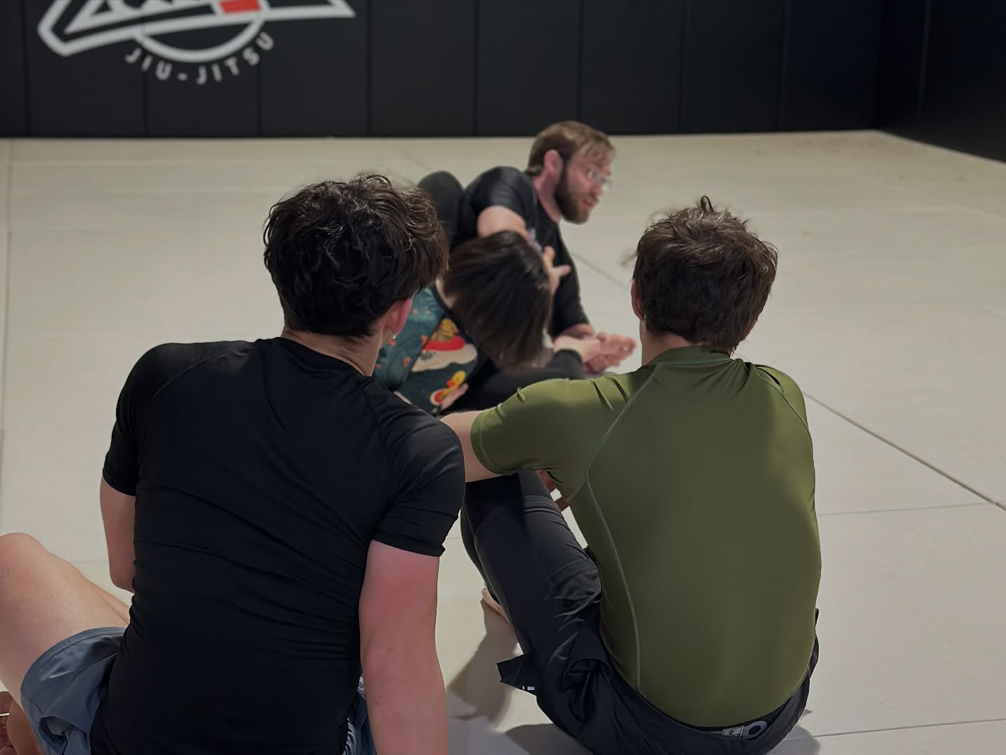 Teen students grappling under coach supervision at Zombie BJJ Allentown PA